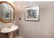 Close up shot of the powder room showcasing the pedestal sink and decorative details at , Lilburn, GA 30047