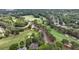 Beautiful aerial view of the community golf course surrounded by lush greenery and luxury homes at 119 Kennemer Ct, Duluth, GA 30097