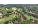 Aerial view of community golf course, with well maintained green grass and landscaping at 119 Kennemer Ct, Duluth, GA 30097