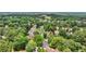 An aerial view showcases a neighborhood enveloped by mature trees at 119 Kennemer Ct, Duluth, GA 30097