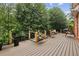 Beautiful back deck featuring well-maintained wood flooring and metal railings at 119 Kennemer Ct, Duluth, GA 30097