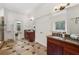 Spacious bathroom featuring granite countertops, dual sinks, and decorative tile flooring at 119 Kennemer Ct, Duluth, GA 30097