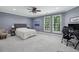 Bright bedroom offers lots of natural light, carpet flooring, and a large desk space at 119 Kennemer Ct, Duluth, GA 30097