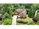 Stunning brick home with lush landscaping and a curved driveway at 119 Kennemer Ct, Duluth, GA 30097