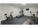 Home gym equipped with a stationary bike, treadmill, and weightlifting equipment for fitness at 119 Kennemer Ct, Duluth, GA 30097
