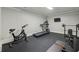 Well-equipped home gym with modern exercise equipment for a complete workout experience at 119 Kennemer Ct, Duluth, GA 30097