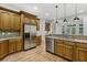 Open kitchen featuring stainless steel appliances and a breakfast bar at 119 Kennemer Ct, Duluth, GA 30097
