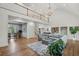 Spacious living room with hardwood floors, high ceilings, and a stunning chandelier at 119 Kennemer Ct, Duluth, GA 30097