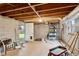 Unfinished basement space with concrete block walls, utility connections, and access to the backyard at 2260 Burlington Ln, Snellville, GA 30078