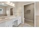 Bathroom featuring double sink vanity, tile flooring, and a separate toilet area at 2260 Burlington Ln, Snellville, GA 30078