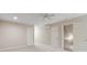 Spacious bedroom features neutral carpeting, a ceiling fan, and multiple doorways at 2260 Burlington Ln, Snellville, GA 30078