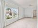 Bedroom with large window and neutral tones, providing a bright and airy atmosphere at 2260 Burlington Ln, Snellville, GA 30078
