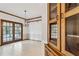 Elegant dining area with tile floors, chandelier, and direct access to outdoor areas and the kitchen at 2260 Burlington Ln, Snellville, GA 30078