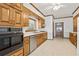 Spacious kitchen with wood cabinets and stainless steel appliances at 2260 Burlington Ln, Snellville, GA 30078