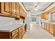 A well-lit kitchen featuring ample counter space, wooden cabinetry, and stainless steel appliances at 2260 Burlington Ln, Snellville, GA 30078