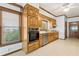 Bright kitchen with wooden cabinets, stainless steel appliances, and a window view at 2260 Burlington Ln, Snellville, GA 30078