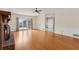 Bright living room with wood floors, brick fireplace, and sliding glass doors to the outdoor patio at 2260 Burlington Ln, Snellville, GA 30078