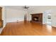 Spacious living room featuring hardwood floors, fireplace, and direct access to other areas of the home at 2260 Burlington Ln, Snellville, GA 30078