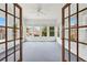 Bright sunroom with a ceiling fan and large windows with an exterior view at 2260 Burlington Ln, Snellville, GA 30078