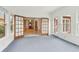 The sunroom features french doors that open to the dining room at 2260 Burlington Ln, Snellville, GA 30078