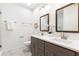 Elegant bathroom featuring double sinks, dark-toned cabinets, and modern fixtures at 2700 Pine Tree Ne Rd # 2201, Atlanta, GA 30324