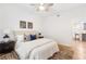 Bright bedroom with a ceiling fan, comfortable bed, and an adjacent kitchen bar at 2700 Pine Tree Ne Rd # 2201, Atlanta, GA 30324