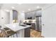 Modern kitchen featuring stainless steel appliances, gray cabinets, and a quartz countertop island at 2700 Pine Tree Ne Rd # 2201, Atlanta, GA 30324