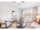 Comfortable living room with a large window, contemporary decor, and a ceiling fan at 2700 Pine Tree Ne Rd # 2201, Atlanta, GA 30324