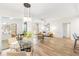 Bright living room featuring wood floors, modern lighting, and stylish furniture at 2700 Pine Tree Ne Rd # 2201, Atlanta, GA 30324