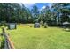 Expansive backyard with a shed, an additional shed, and a gazebo at 2969 White Ne Rd, Conyers, GA 30012