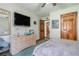 Inviting bedroom features a television and light dresser at 2969 White Ne Rd, Conyers, GA 30012