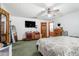 Large primary bedroom with ceiling fan, closet, and en suite bathroom at 2969 White Ne Rd, Conyers, GA 30012