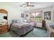 Comfortable bedroom features a ceiling fan, window, and two dressers at 2969 White Ne Rd, Conyers, GA 30012