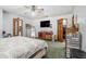 Large primary bedroom with closet, ceiling fan, and en suite bathroom at 2969 White Ne Rd, Conyers, GA 30012