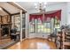 Cozy dining area with built-in shelving, hardwood floors, and a large bay window providing ample light at 2969 White Ne Rd, Conyers, GA 30012