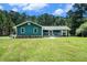 Charming single story home with a covered front porch and beautifully maintained lawn at 2969 White Ne Rd, Conyers, GA 30012