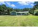 Lovely single story home with a front porch, and a large green lawn at 2969 White Ne Rd, Conyers, GA 30012