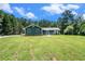 Single story home with a covered front porch, set on a well-maintained spacious lawn at 2969 White Ne Rd, Conyers, GA 30012