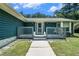 Inviting front porch with lion statues and a security system offers a welcoming entrance at 2969 White Ne Rd, Conyers, GA 30012