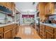 Bright eat-in kitchen with bay window and wood cabinetry at 2969 White Ne Rd, Conyers, GA 30012