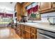 Charming kitchen with wood cabinets, laminate countertops, stainless steel appliances, and natural light at 2969 White Ne Rd, Conyers, GA 30012