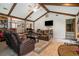 Beautiful living room with vaulted ceilings, wood beams, hardwood floors and access to other rooms at 2969 White Ne Rd, Conyers, GA 30012
