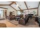 Bright and airy living room with wood floors, vaulted ceilings and easy access to other rooms at 2969 White Ne Rd, Conyers, GA 30012
