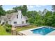 Gorgeous white home with a stunning pool, deck, and fenced yard perfect for entertaining at 326 Seldom Seen Trl, Canton, GA 30115