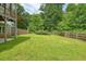 Spacious grassy backyard offers privacy and opportunities for recreation and relaxation at 326 Seldom Seen Trl, Canton, GA 30115