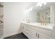Bright bathroom features double vanity, marble countertops, modern fixtures and tiled shower at 326 Seldom Seen Trl, Canton, GA 30115
