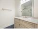 Bathroom featuring a marble countertop, updated fixtures, and glass shower at 326 Seldom Seen Trl, Canton, GA 30115