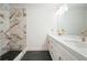Stylish bathroom with double vanity, marble countertops, and tiled shower with rain shower head at 326 Seldom Seen Trl, Canton, GA 30115