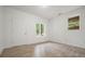 Bedroom with neutral colors, tiled floors, a window and access to the hallway at 326 Seldom Seen Trl, Canton, GA 30115