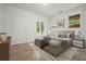 Well-lit bedroom featuring a neutral color palette, comfortable furniture, and a window view at 326 Seldom Seen Trl, Canton, GA 30115